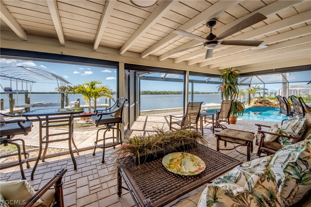 11599 Island Avenue Matlacha, FL 33993 - Photo 26 of 38 a view of a dining room with furniture window and outside view