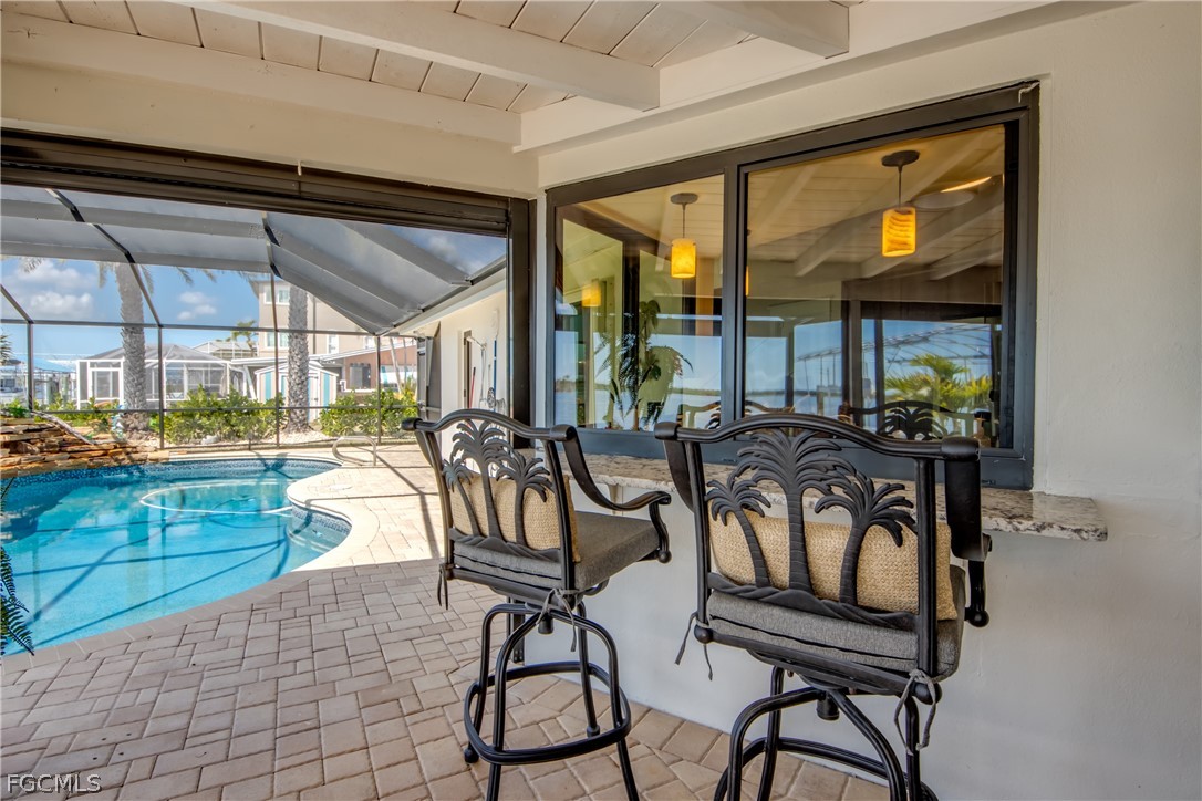 11599 Island Avenue Matlacha, FL 33993 - Photo 28 of 38 a view of a dining room with furniture window and outside view