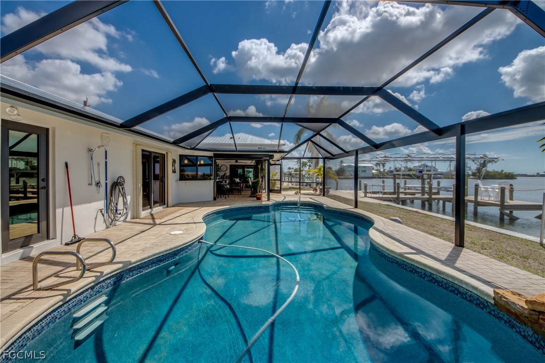 11599 Island Avenue Matlacha, FL 33993 - Photo 30 of 38 a view of a swimming pool with a patio