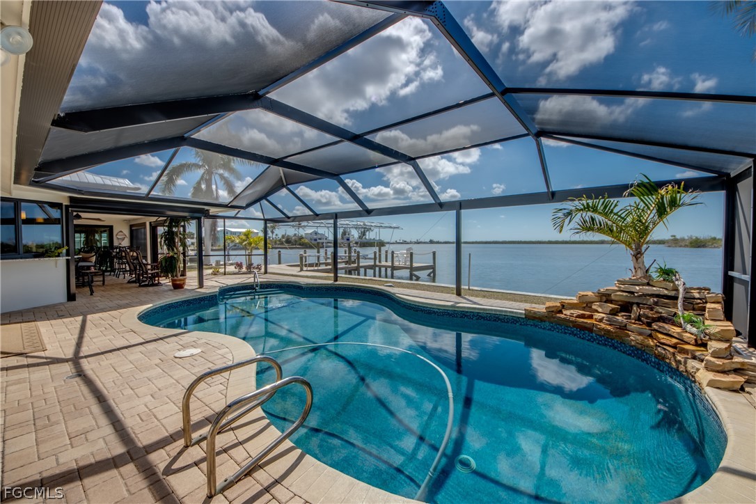 11599 Island Avenue Matlacha, FL 33993 - Photo 32 of 38 a view of a swimming pool with a patio