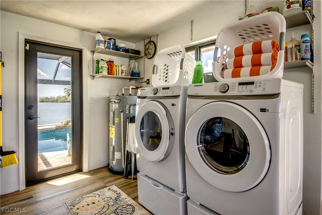 11599 Island Avenue Matlacha, FL 33993 - Photo 36 of 38 a view of a bedroom with washer and dryer