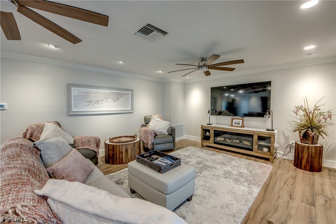 11599 Island Avenue Matlacha, FL 33993 - Photo 6 of 38 a living room with furniture and a flat screen tv
