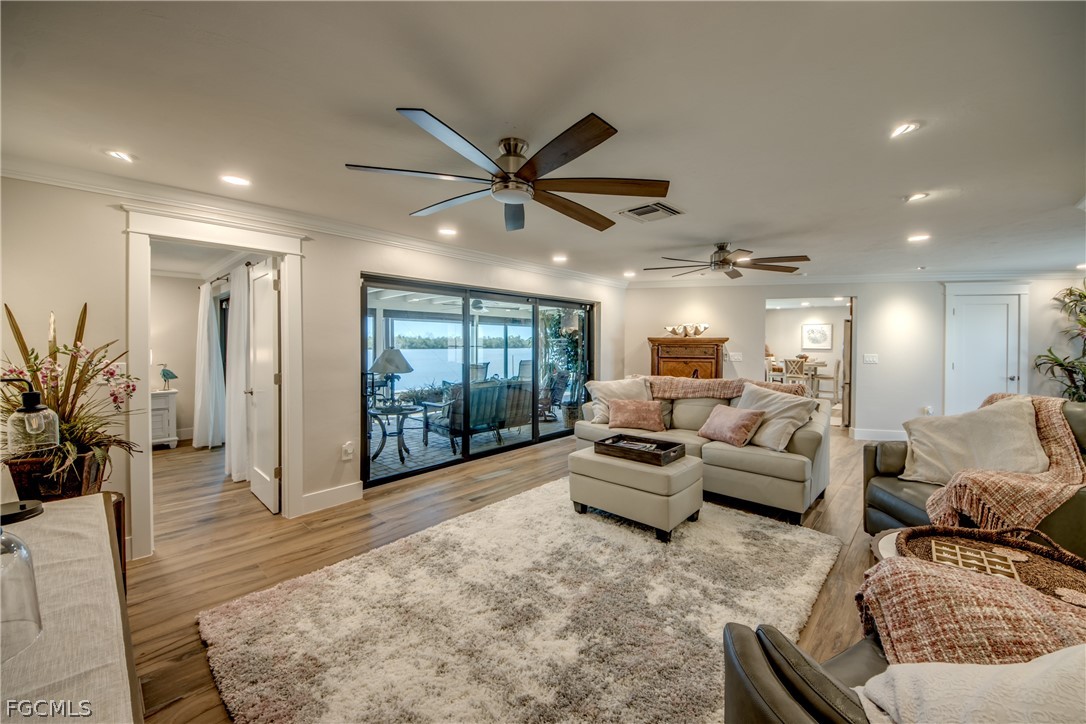 11599 Island Avenue Matlacha, FL 33993 - Photo 8 of 38 a living room with furniture and a large window