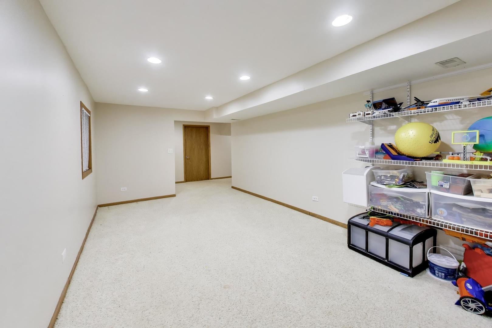 873 Hampton Drive Carol Stream, IL 60188 - Photo 35 of 43 a room with furniture and air hockey table