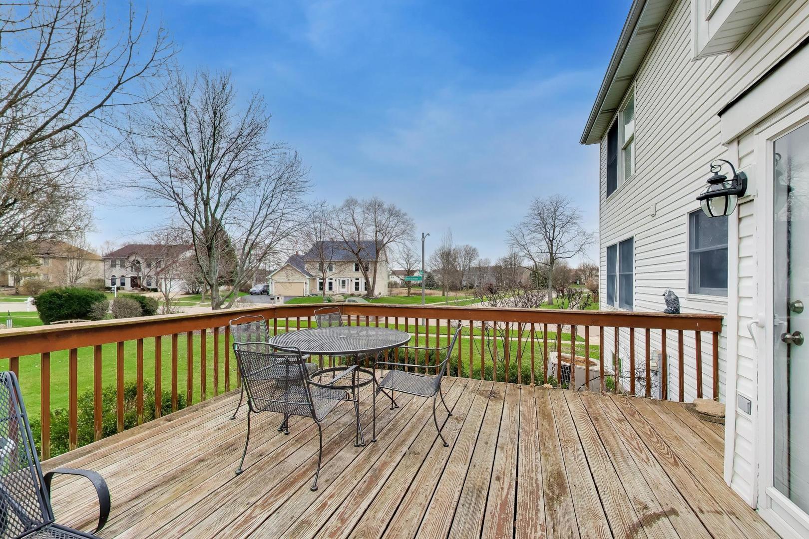 873 Hampton Drive Carol Stream, IL 60188 - Photo 36 of 43 a view of balcony with wooden floor and fence