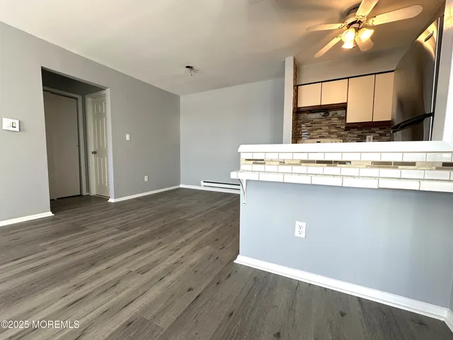 a view of kitchen with wooden floor
