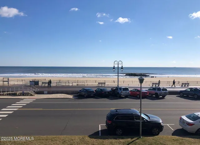 a car parked on the street next to a building
