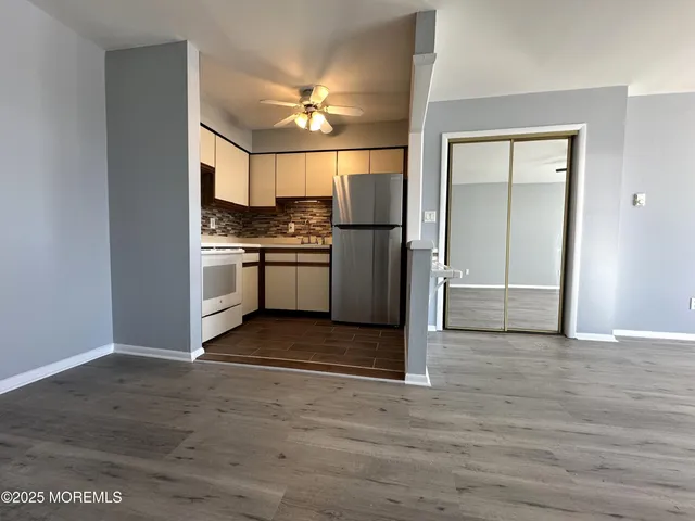 a view of a kitchen with a sink and a stove top oven