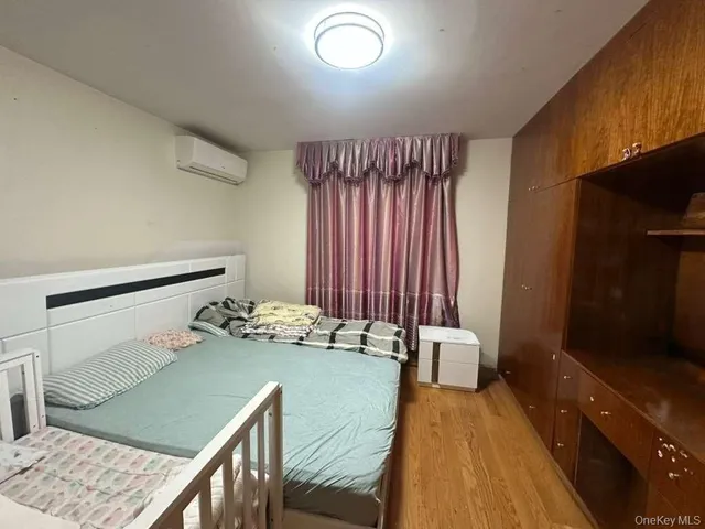 a hallway with a table and chairs