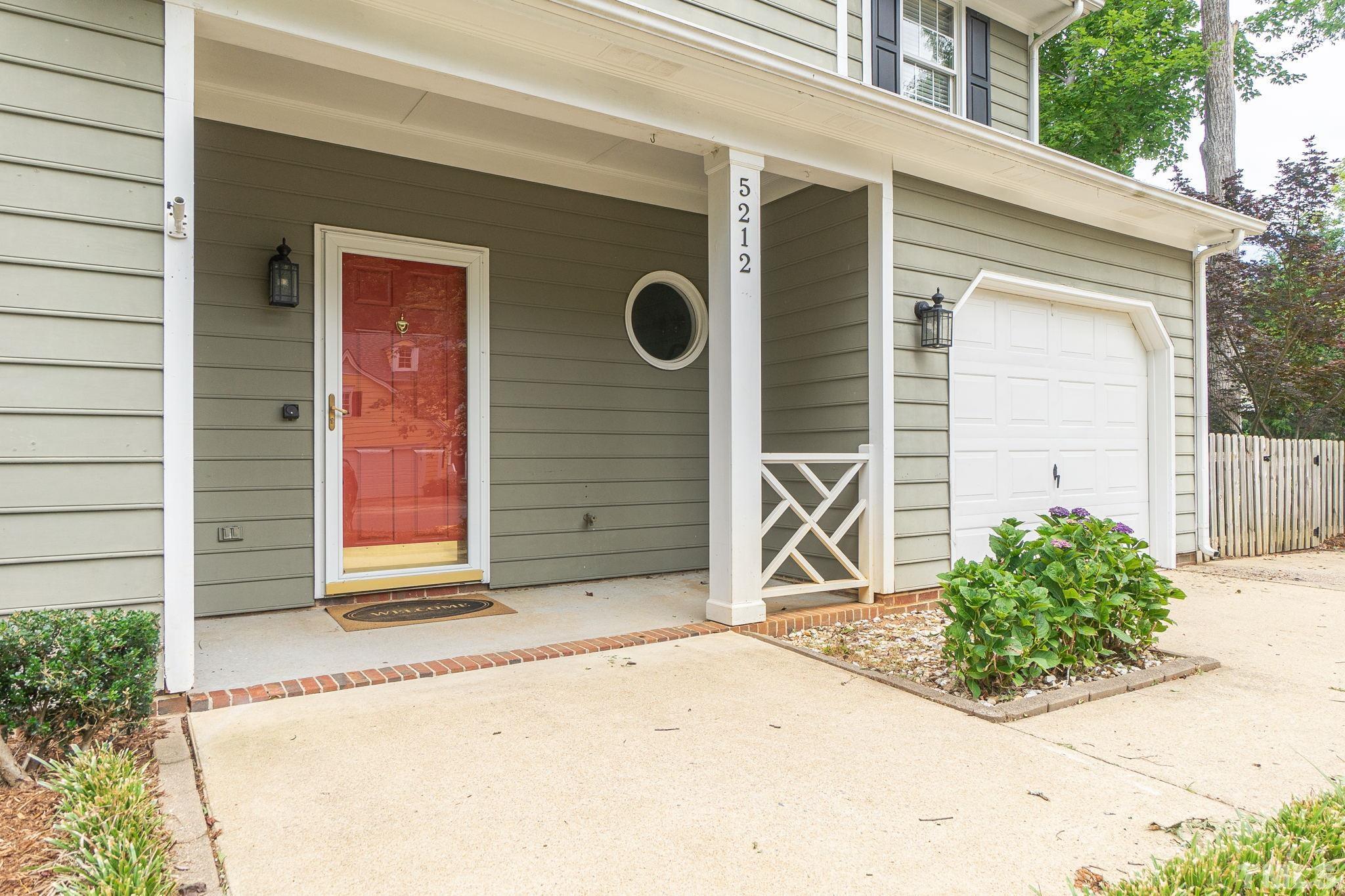 5212 Blakeley Lane Raleigh, NC 27613 - Photo 3 of 45 a front view of a house with garage