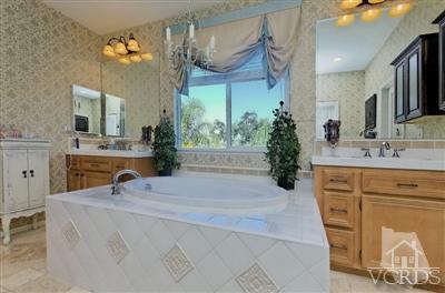 1590 Hidden Ranch Drive Simi Valley, CA 93063 - Photo 8 of 23 a bathroom with a sink and a mirror