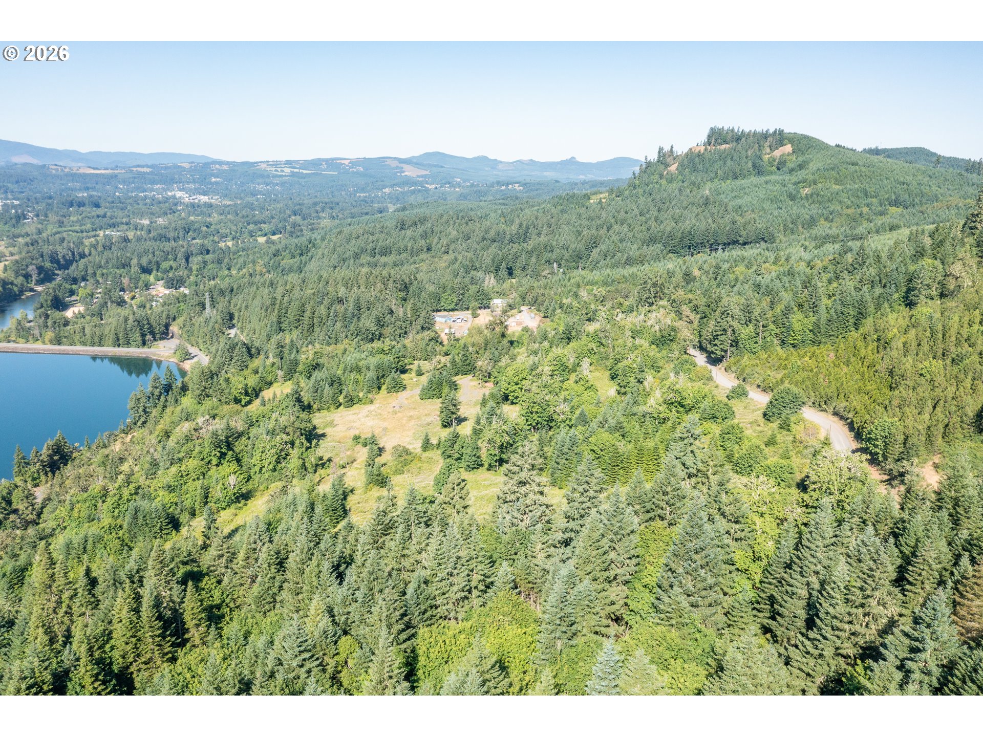 Jones Drive, Unit TL 1700 Foster, OR 97345 - Photo 4 of 19 a view of a lush green forest with trees and some houses