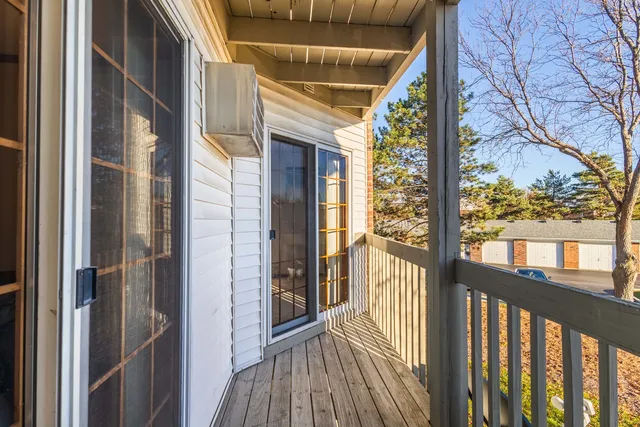 a view of a balcony with wooden floor