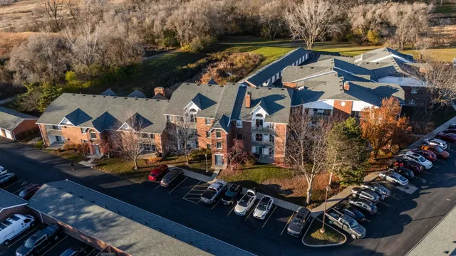 a view of multiple houses with swimming pool