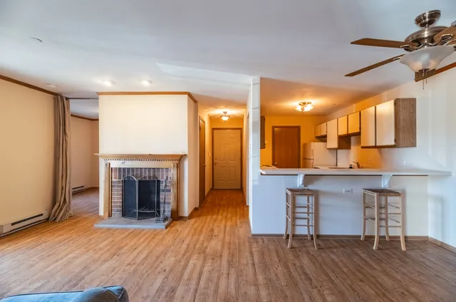 a view of kitchen with furniture and fireplace