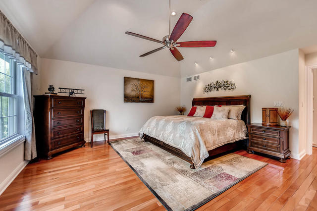129 Turkey Run Road Trout Valley, IL 60013 - Photo 14 of 35 a bedroom with a bed and wooden floor
