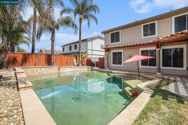 a view of a house with swimming pool