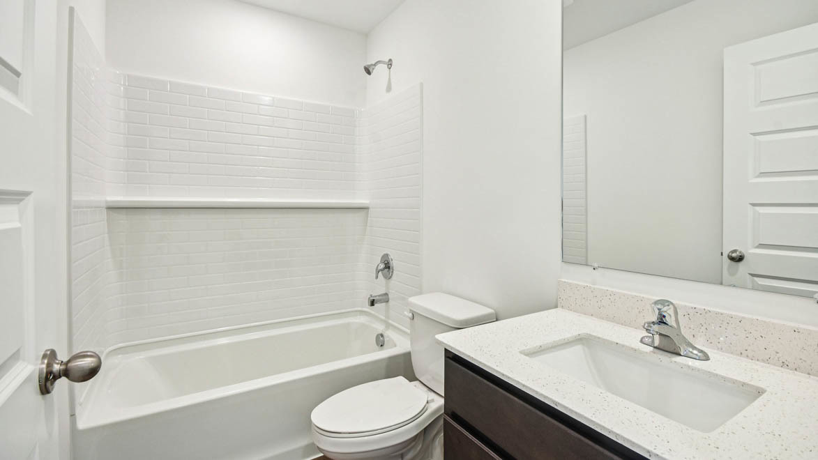392 Summit Circle Lombard, IL 60148 - Photo 51 of 61 a bathroom with a granite countertop sink toilet a mirror and shower