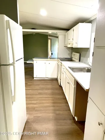 a bathroom with a sink a mirror and a bathtub
