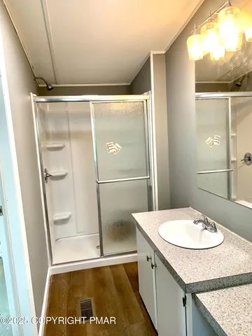 a bathroom with a sink and mirror