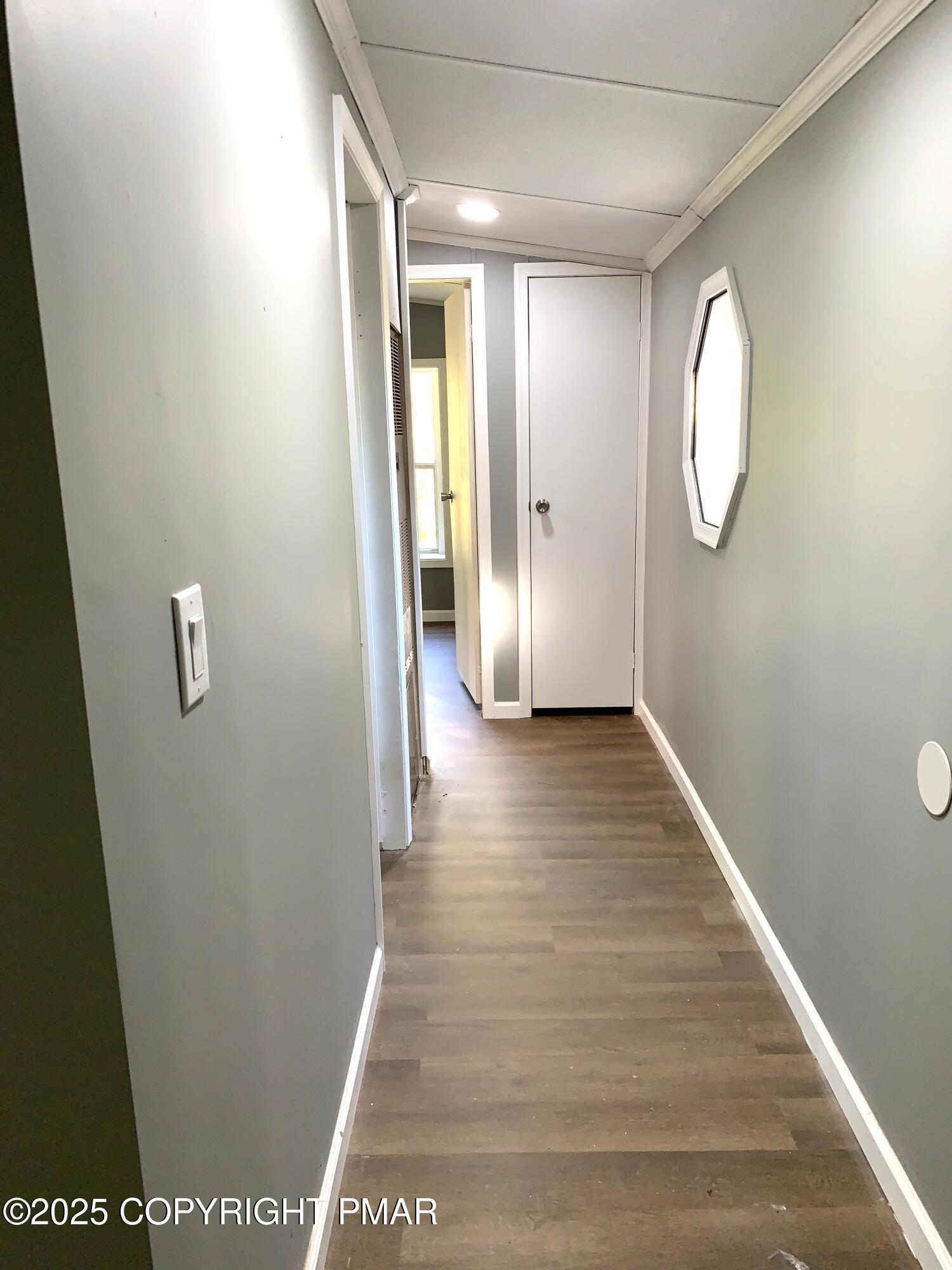 146 Paul Terrace Scotrun, PA 18355 - Photo 8 of 13 a view of a hallway with wooden floor