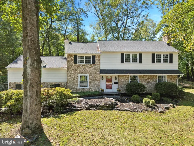a view of a house with swimming pool and porch