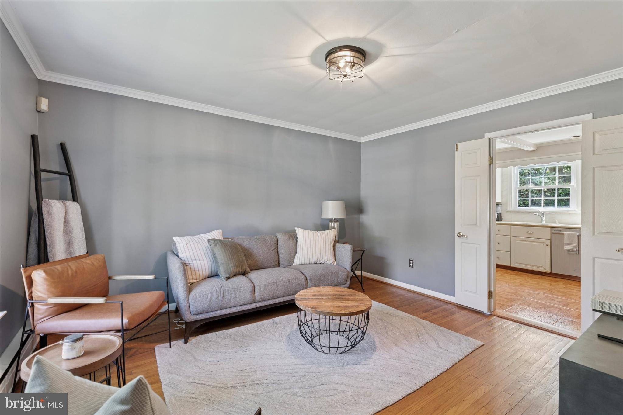 711 Custis Road Glenside, PA 19038 - Photo 11 of 53 a living room with furniture and a window