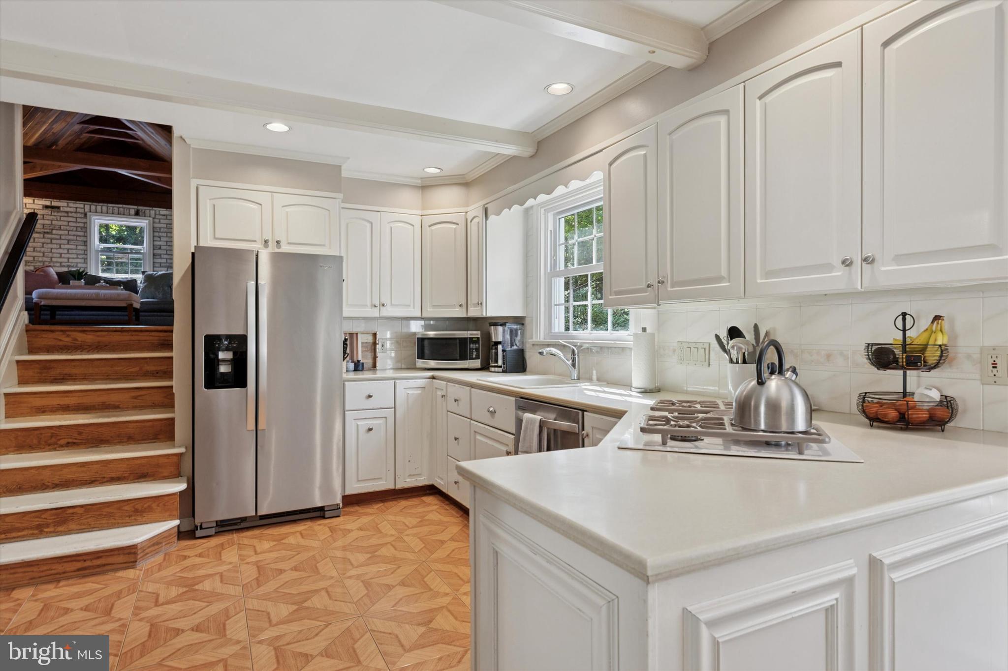711 Custis Road Glenside, PA 19038 - Photo 14 of 53 a kitchen with a sink appliances and cabinets