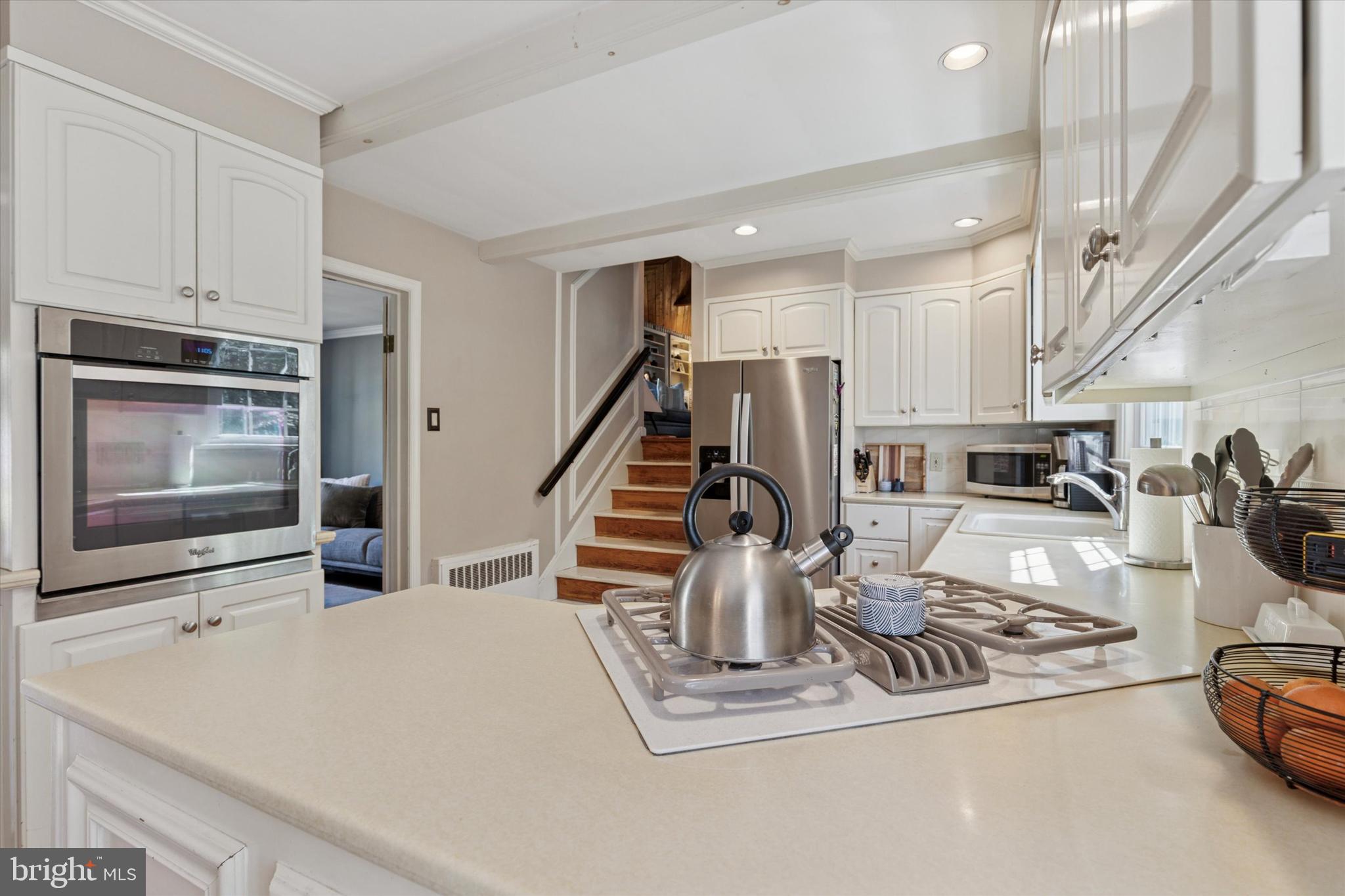 711 Custis Road Glenside, PA 19038 - Photo 15 of 53 a kitchen with sink a stove and cabinets