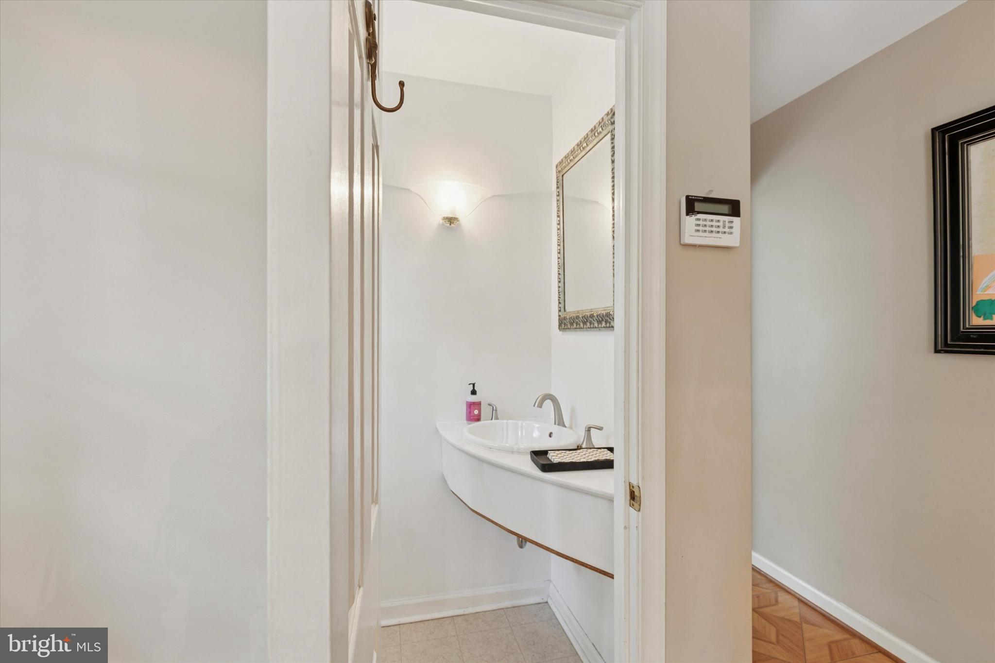 711 Custis Road Glenside, PA 19038 - Photo 20 of 53 a bathroom with a sink and a mirror
