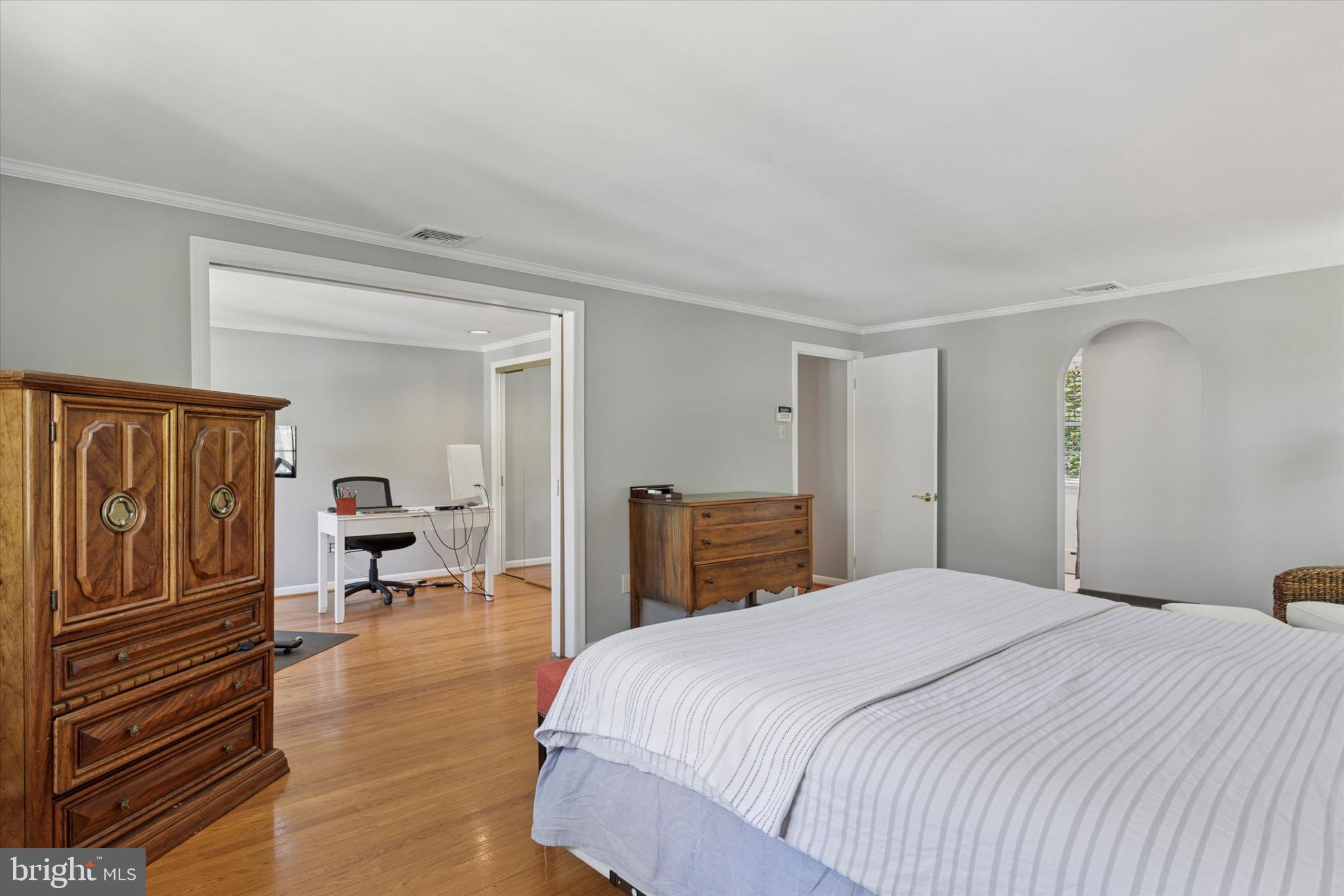 711 Custis Road Glenside, PA 19038 - Photo 22 of 53 a bedroom with a balcony a bed and dresser with mirror