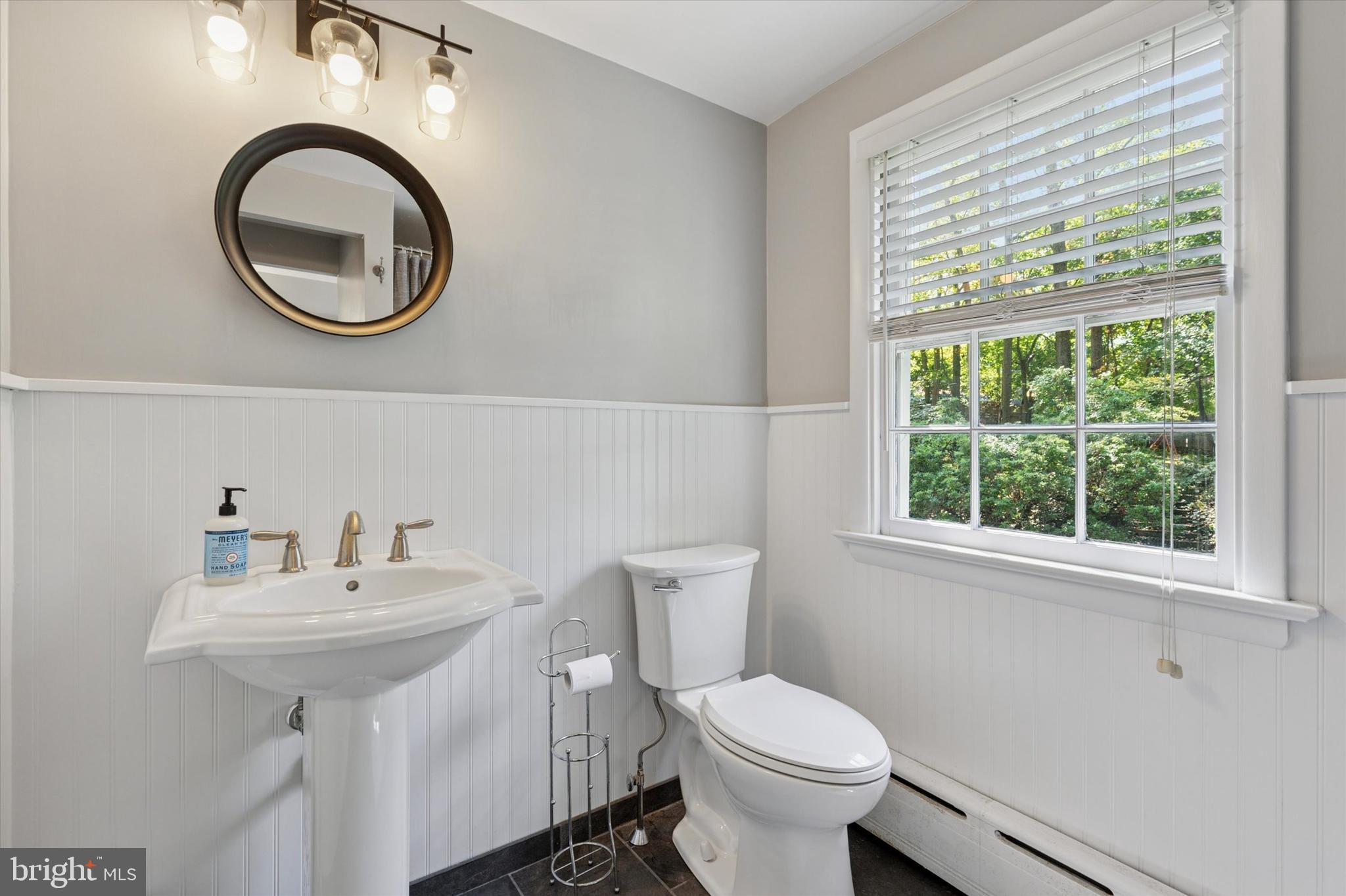 711 Custis Road Glenside, PA 19038 - Photo 24 of 53 a bathroom with a toilet a sink and a mirror