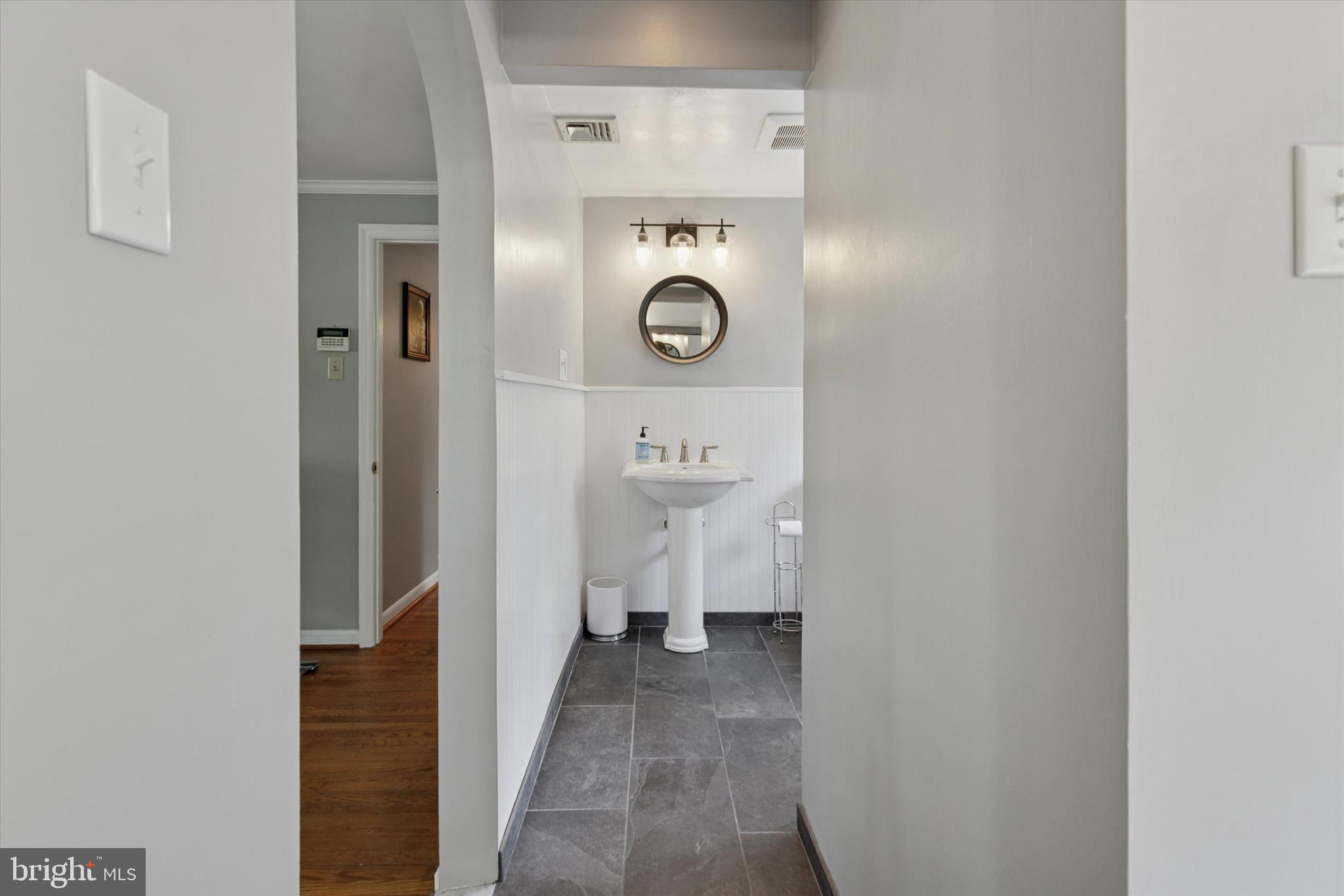 711 Custis Road Glenside, PA 19038 - Photo 26 of 53 a view of a hallway with wooden floor
