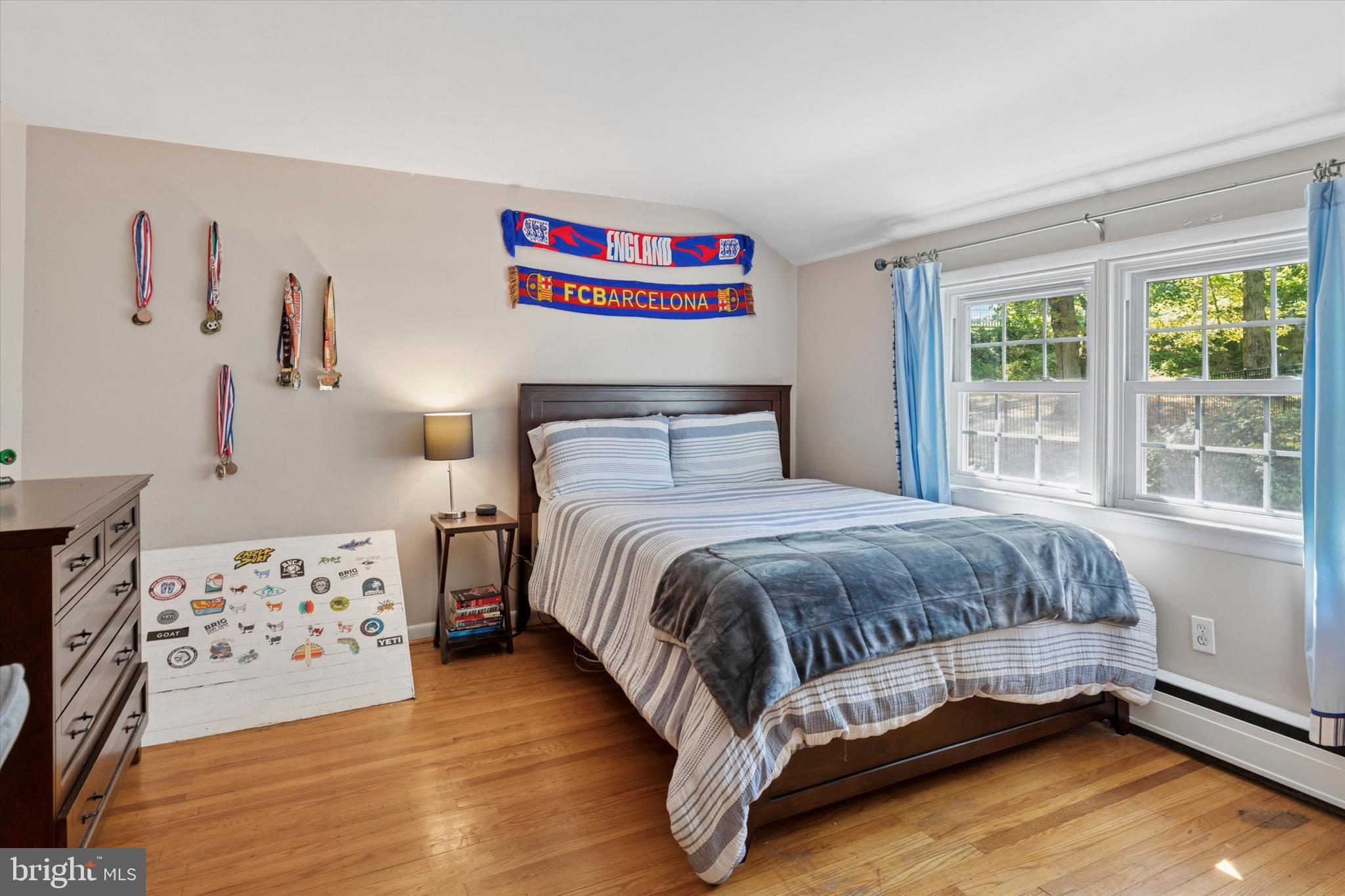 711 Custis Road Glenside, PA 19038 - Photo 33 of 53 a bedroom with a bed and wooden floor