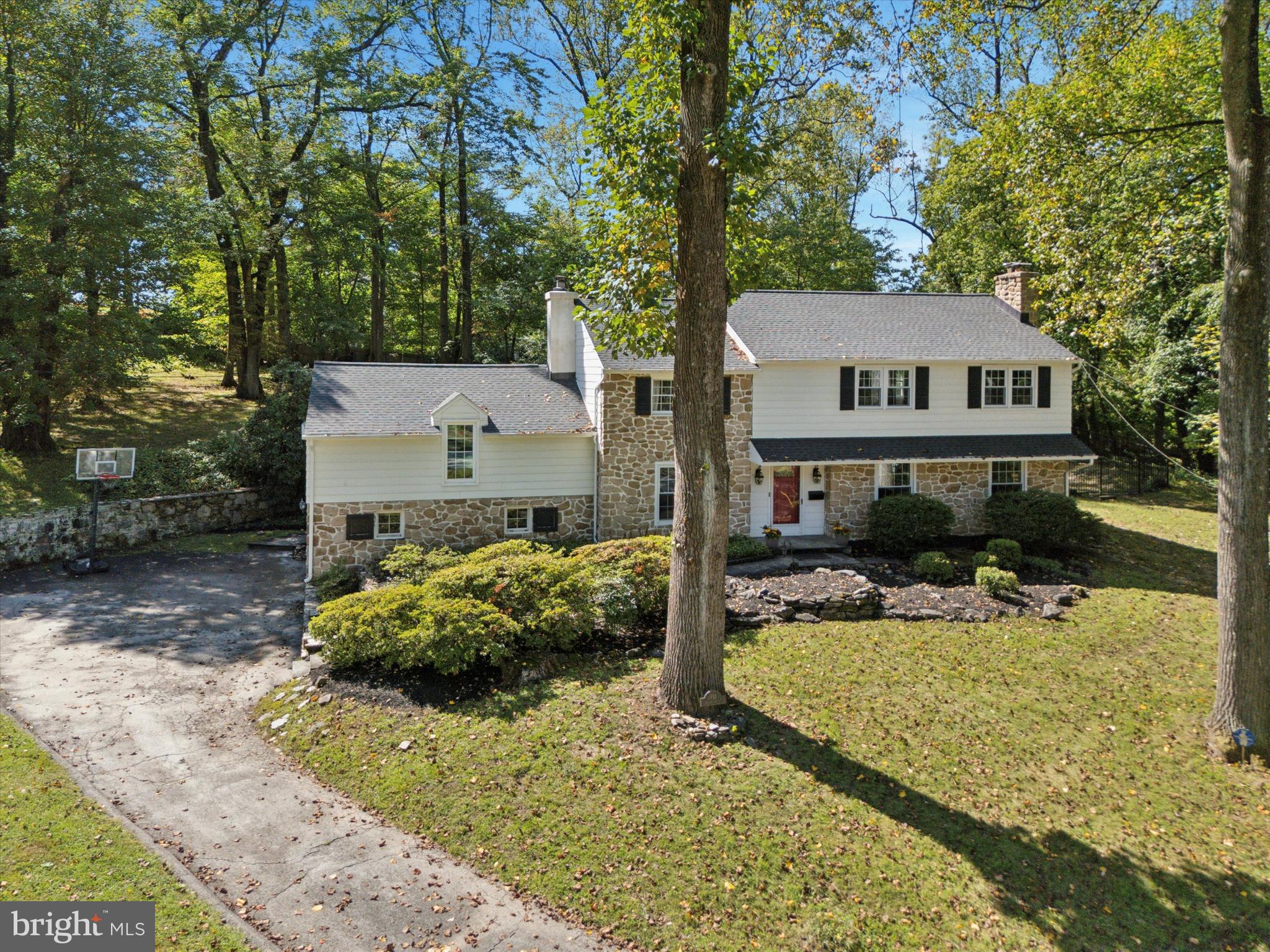 711 Custis Road Glenside, PA 19038 - Photo 46 of 53 a view of a house with a yard covered with snow in the background
