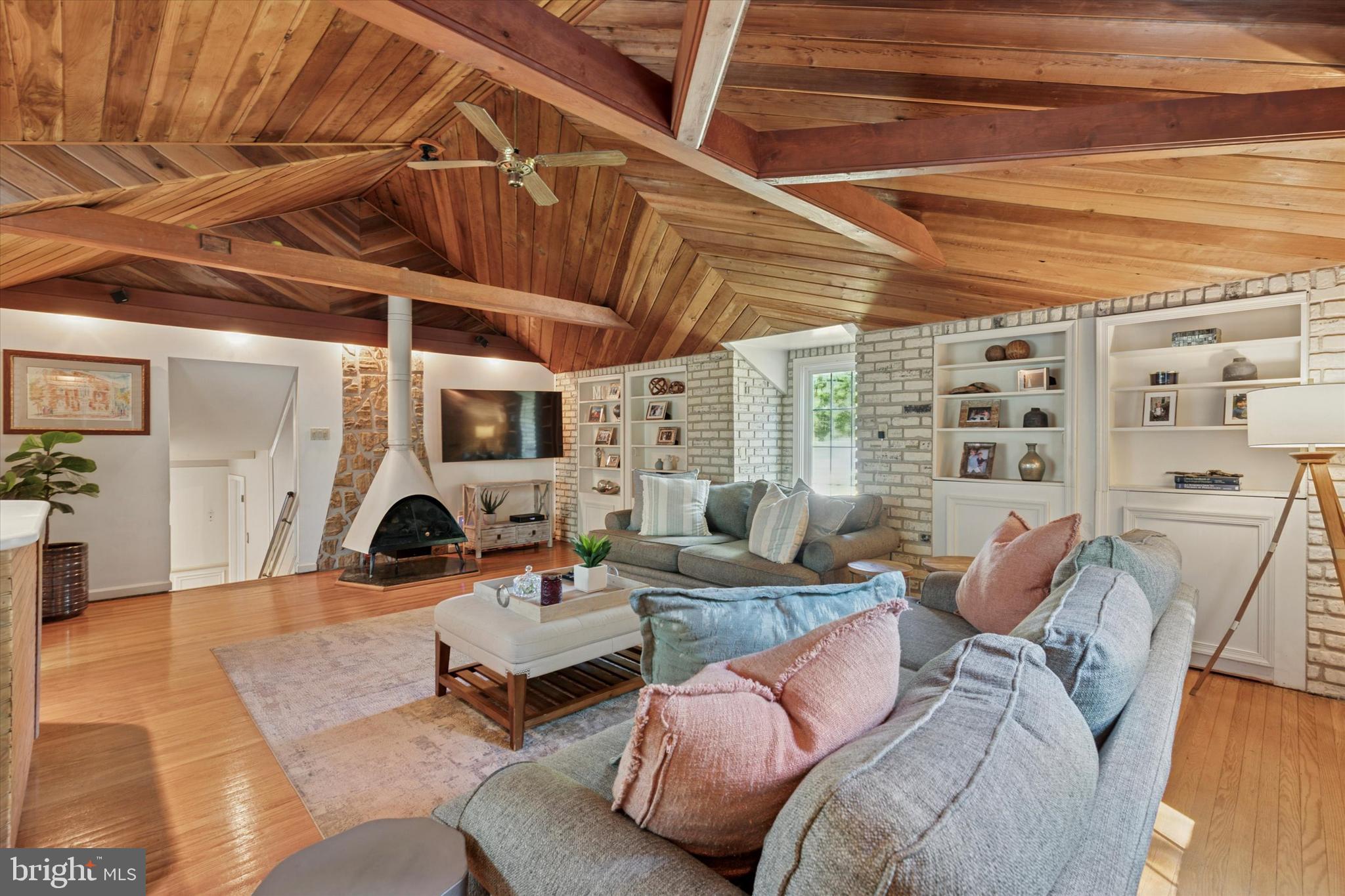 711 Custis Road Glenside, PA 19038 - Photo 6 of 53 a living room with furniture and a chandelier