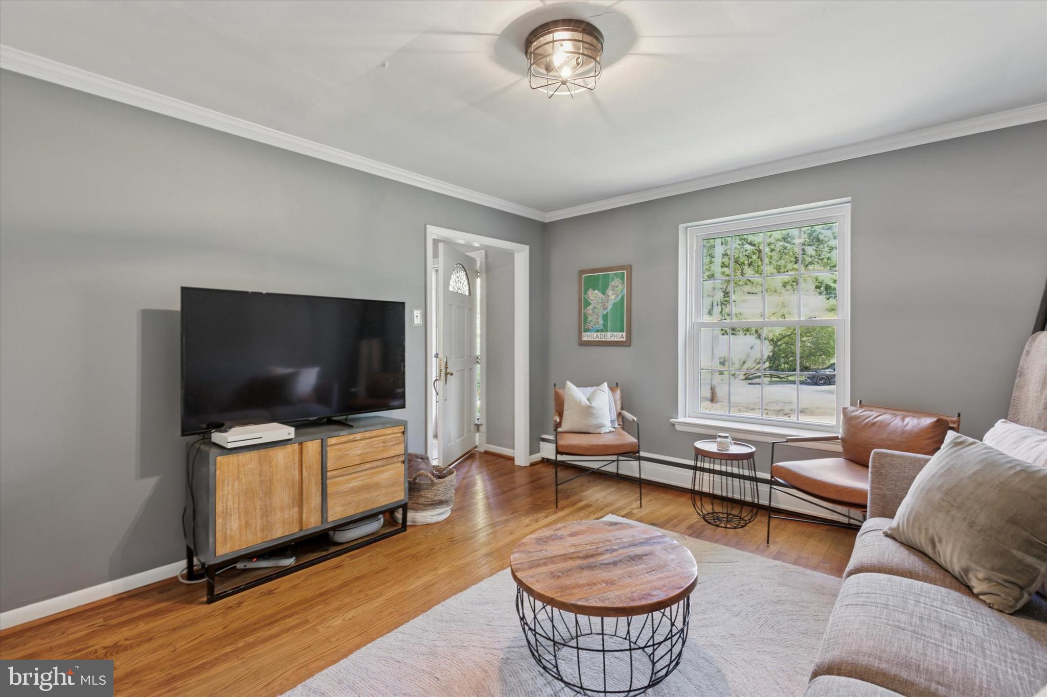 711 Custis Road Glenside, PA 19038 - Photo 10 of 53 a living room with furniture and a flat screen tv