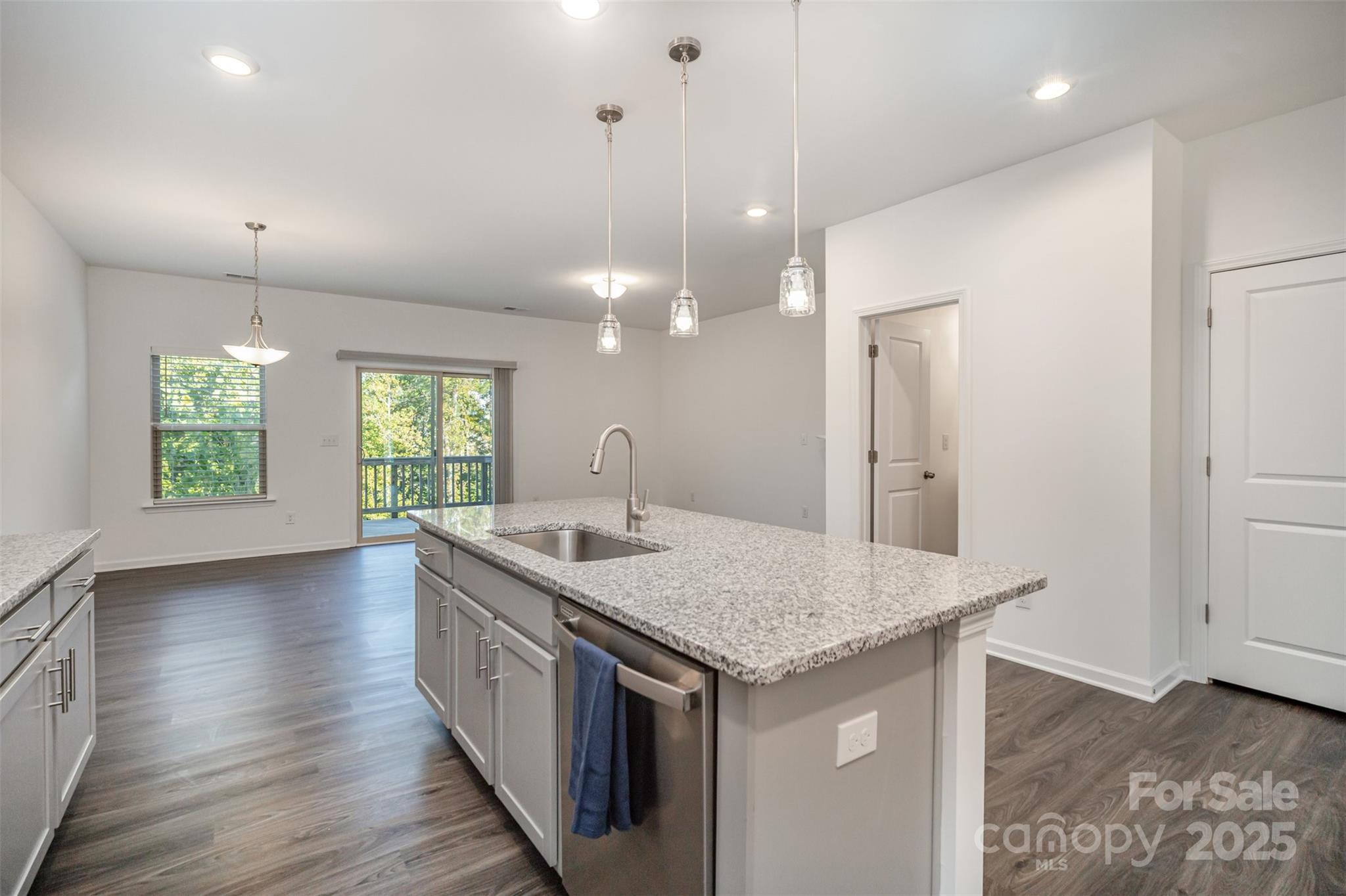 558 Dulaney Drive Tega Cay, SC 29708 - Photo 14 of 30 an open kitchen with a sink and dish washer
