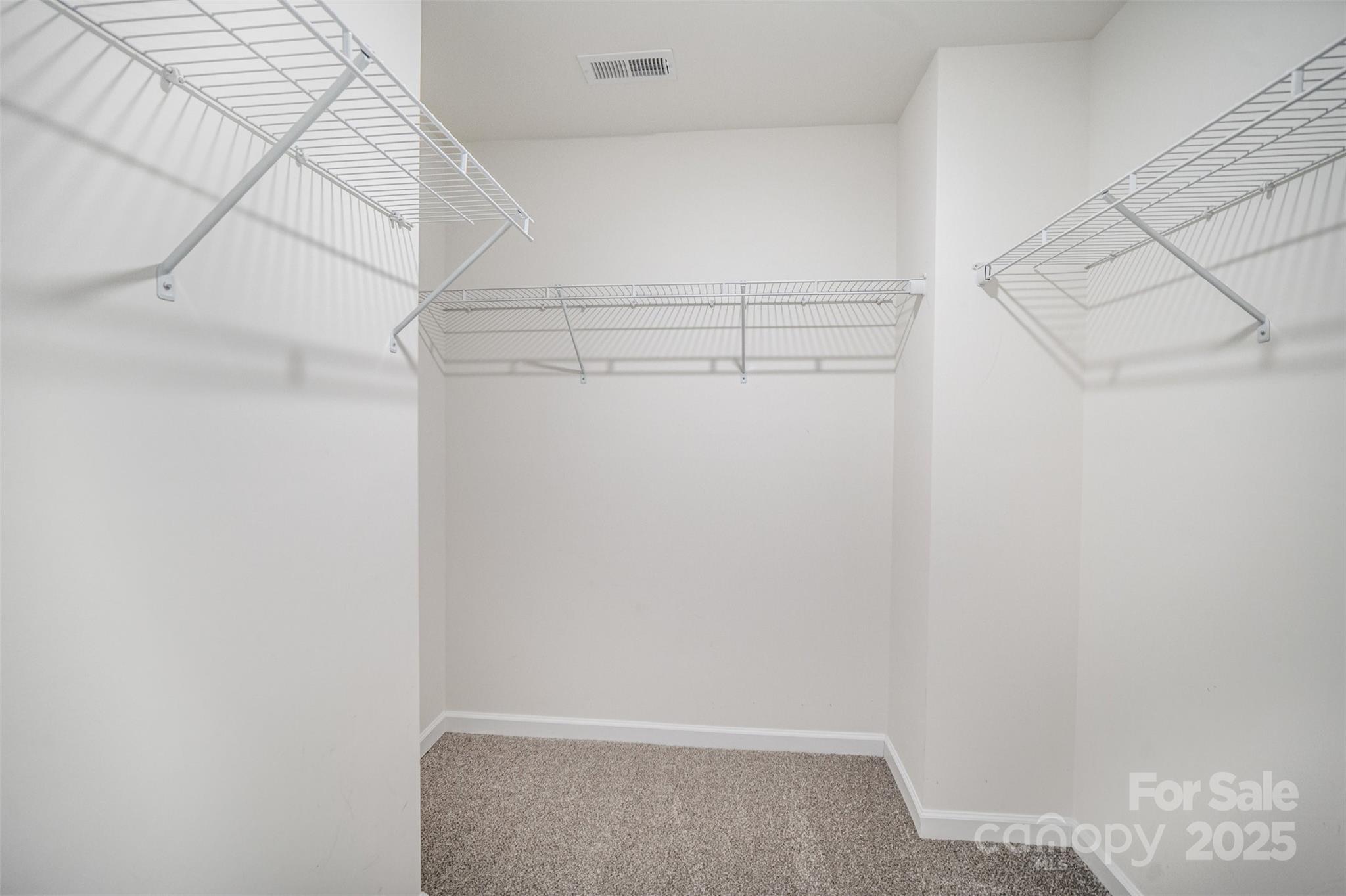 558 Dulaney Drive Tega Cay, SC 29708 - Photo 23 of 30 a view of a room with racks on the wall