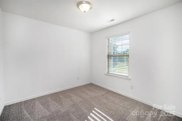 a balcony with table and chairs