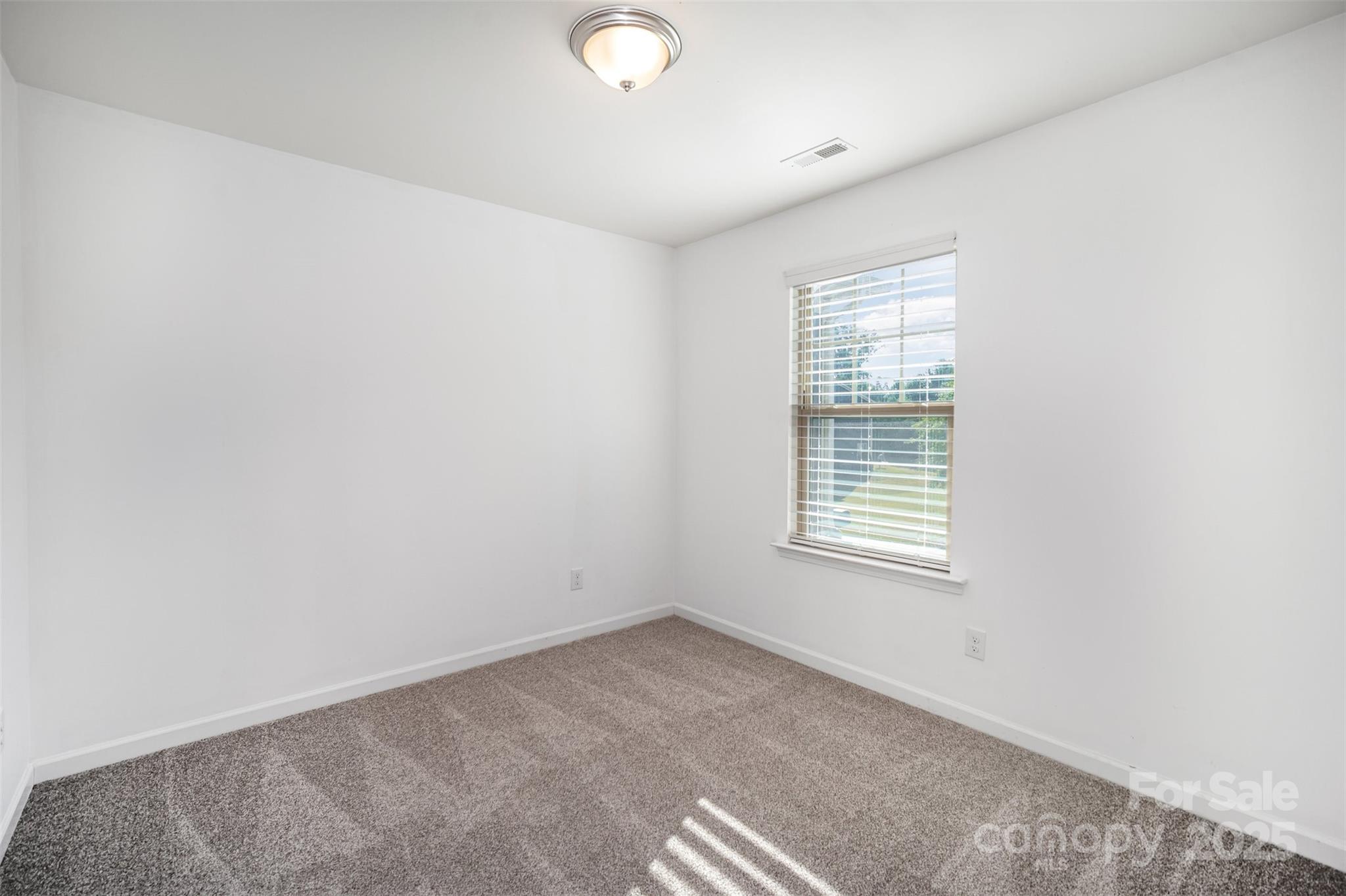 558 Dulaney Drive Tega Cay, SC 29708 - Photo 24 of 30 an empty room with a window