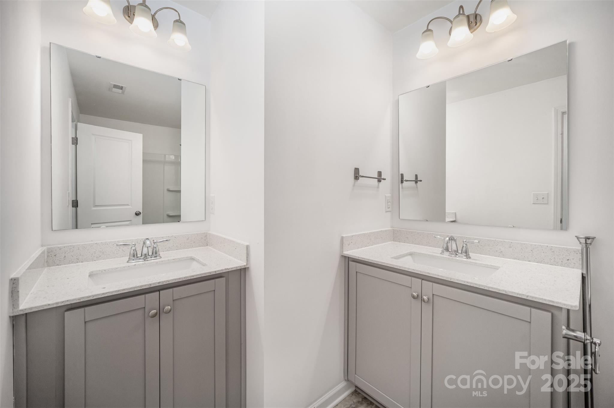 558 Dulaney Drive Tega Cay, SC 29708 - Photo 25 of 30 a bathroom with a sink and a mirror
