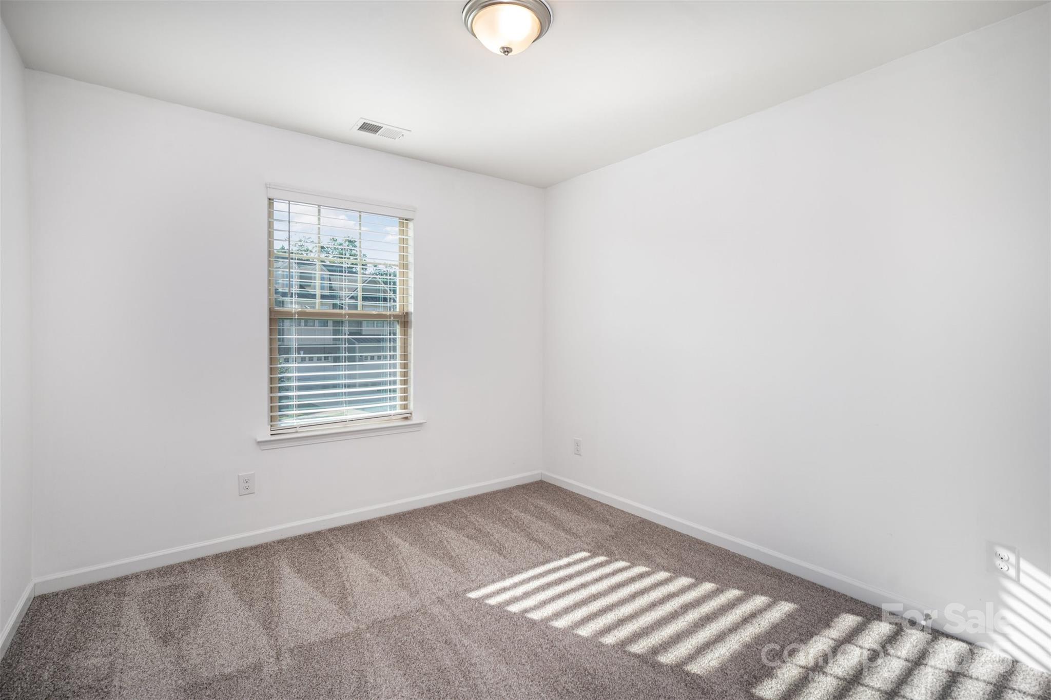 558 Dulaney Drive Tega Cay, SC 29708 - Photo 26 of 30 a view of an empty room with a window