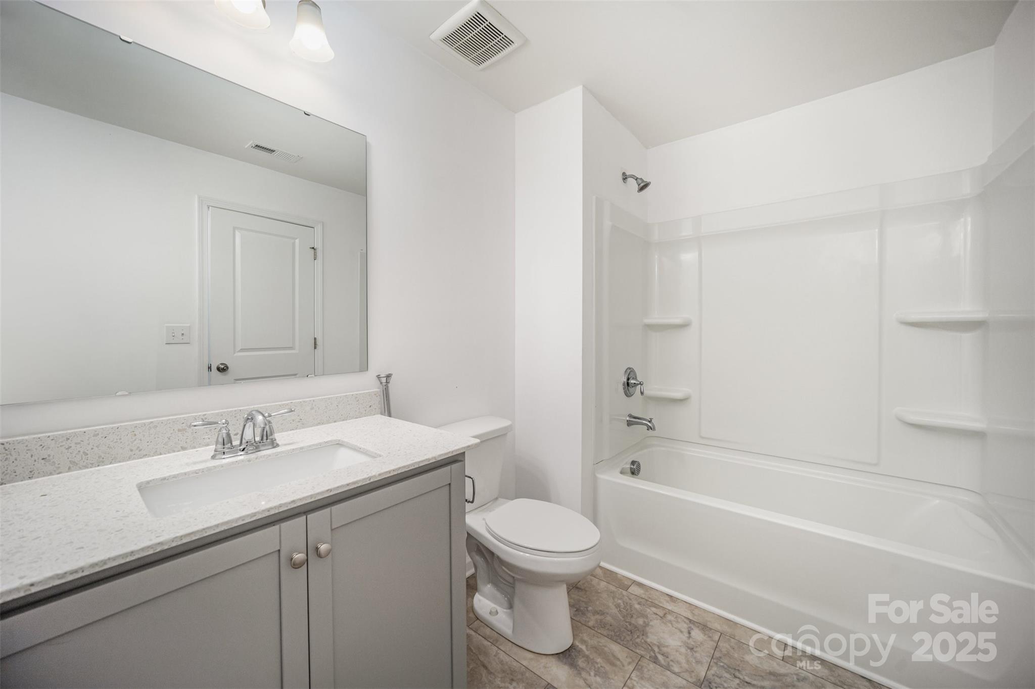 558 Dulaney Drive Tega Cay, SC 29708 - Photo 27 of 30 a bathroom with a sink a toilet and shower