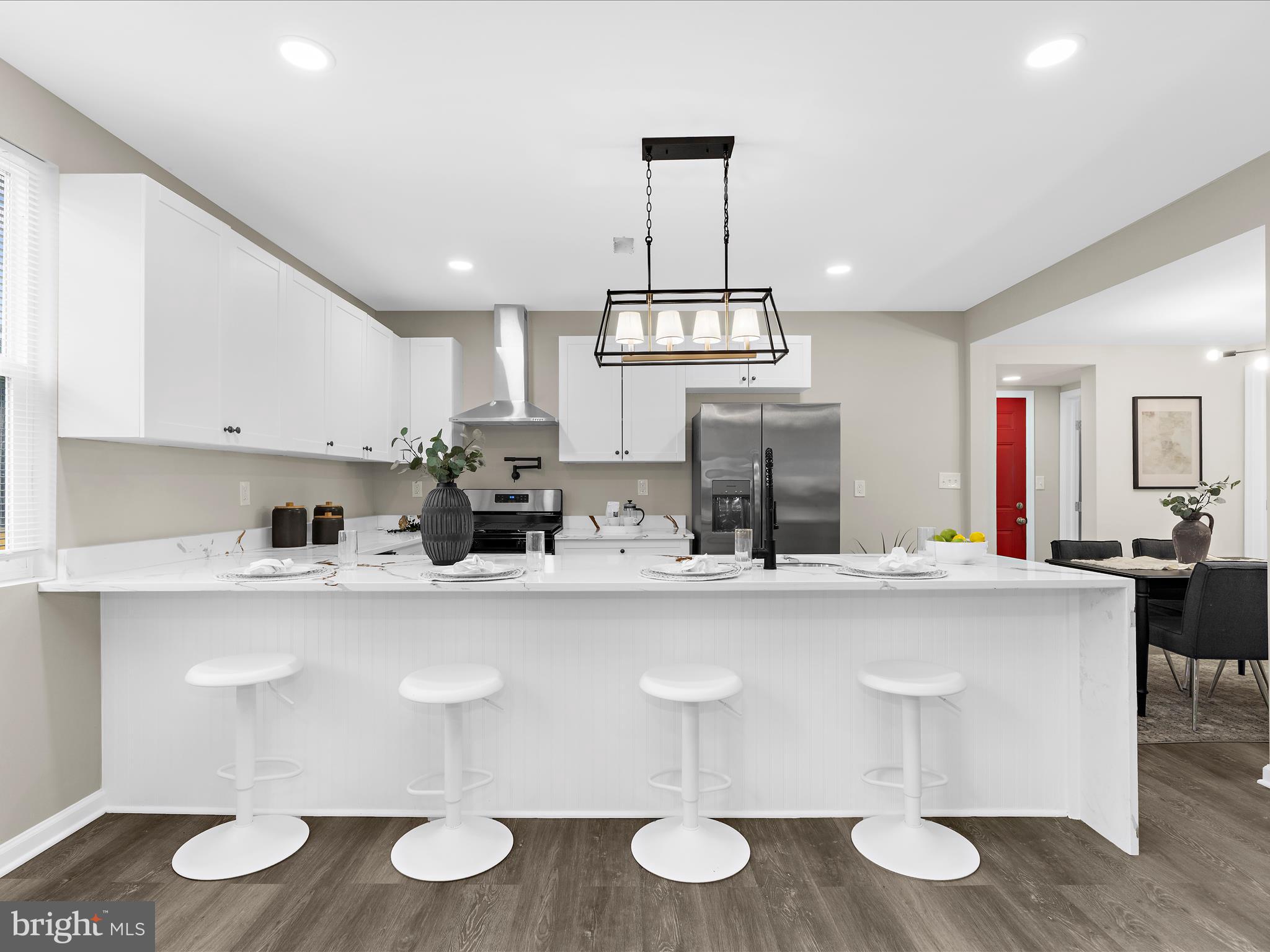 3708 Mohawk Avenue Baltimore, MD 21207 - Photo 11 of 54 a kitchen with a table and chairs in it