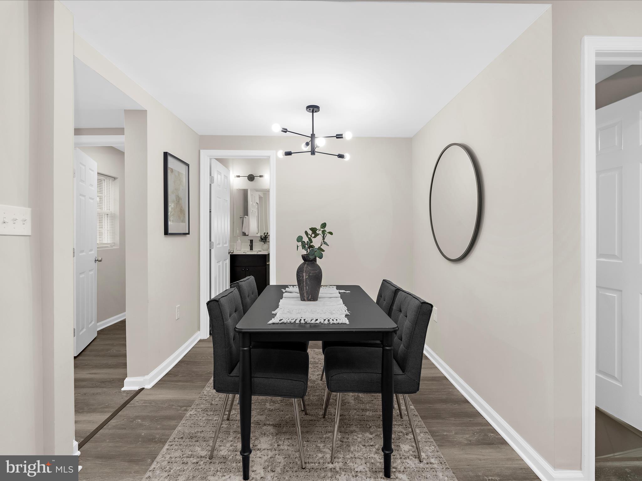 3708 Mohawk Avenue Baltimore, MD 21207 - Photo 15 of 54 a dining room with furniture and a mirror