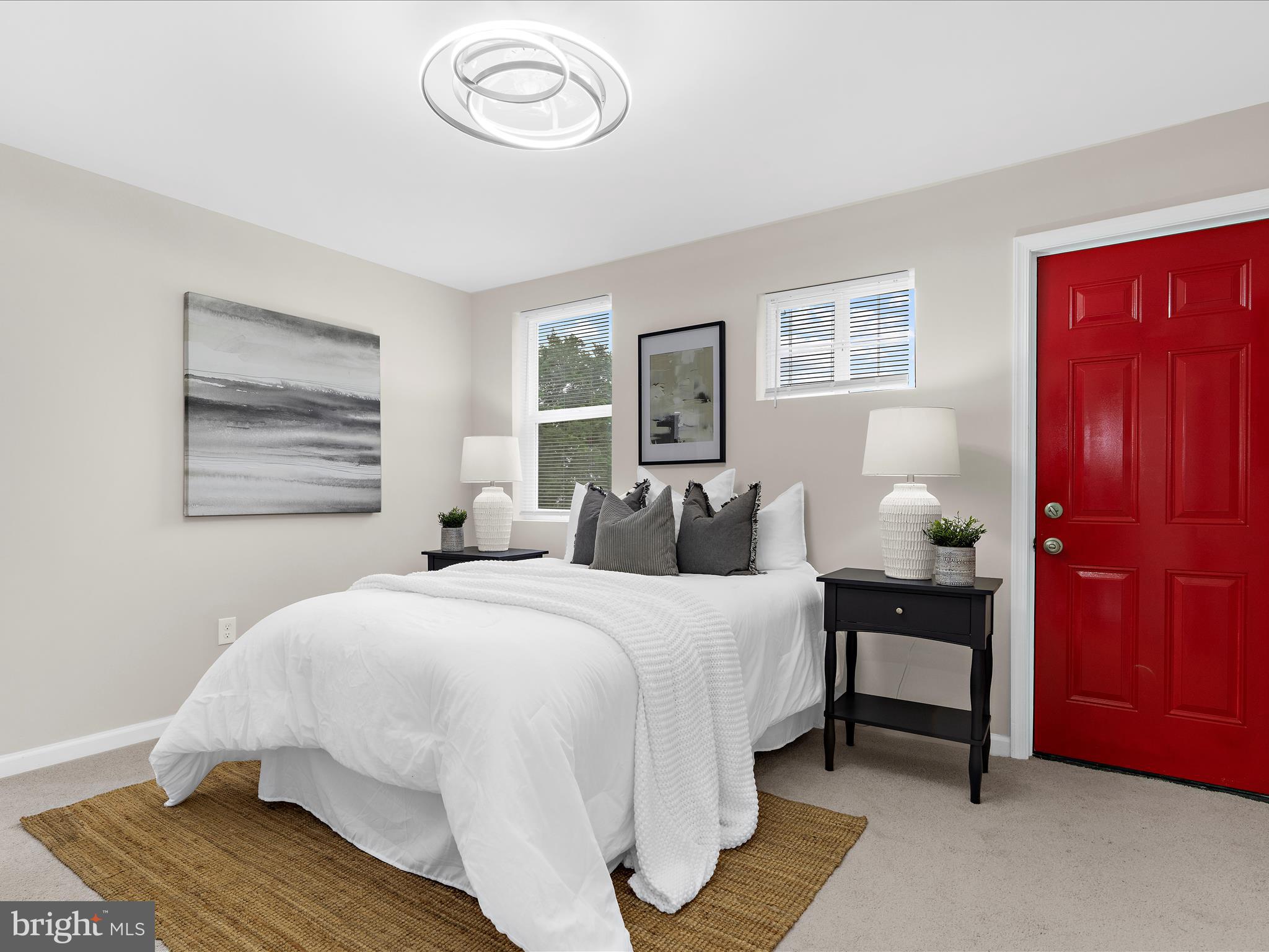 3708 Mohawk Avenue Baltimore, MD 21207 - Photo 20 of 54 a bedroom with a bed and wooden floor