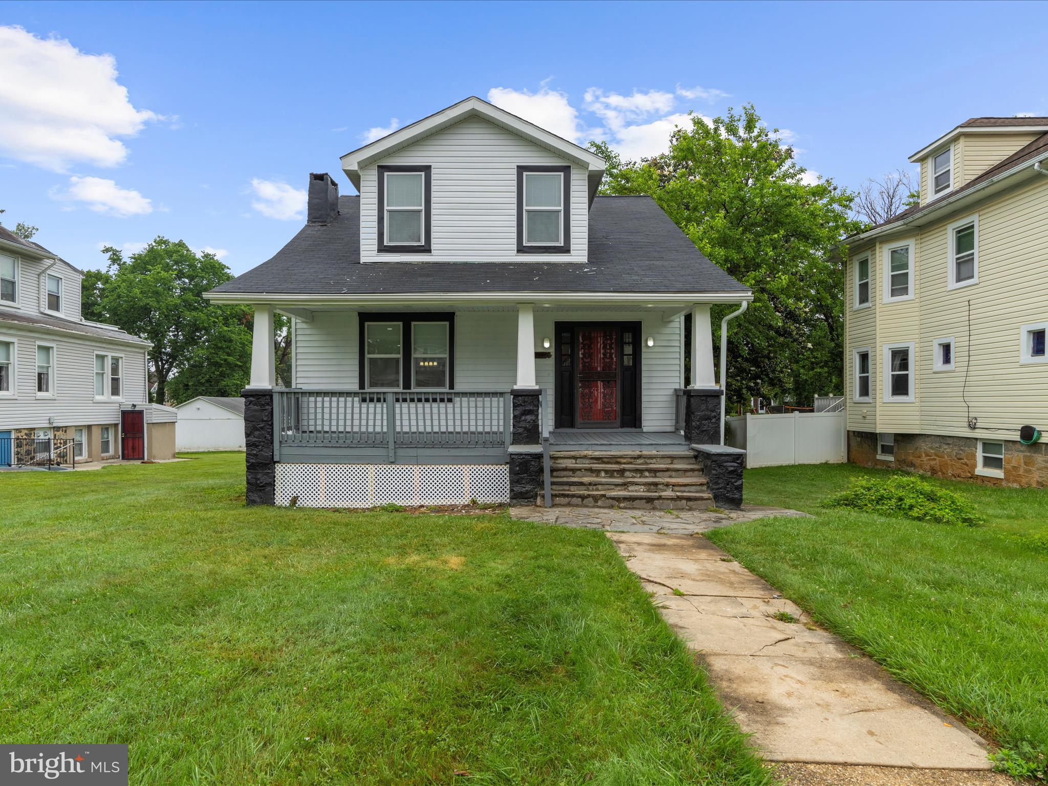 3708 Mohawk Avenue Baltimore, MD 21207 - Photo 2 of 54 a view of a house with a yard
