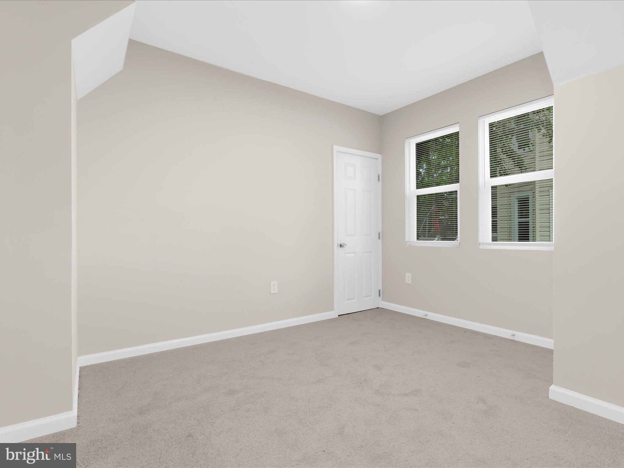3708 Mohawk Avenue Baltimore, MD 21207 - Photo 26 of 54 a view of an empty room with a window