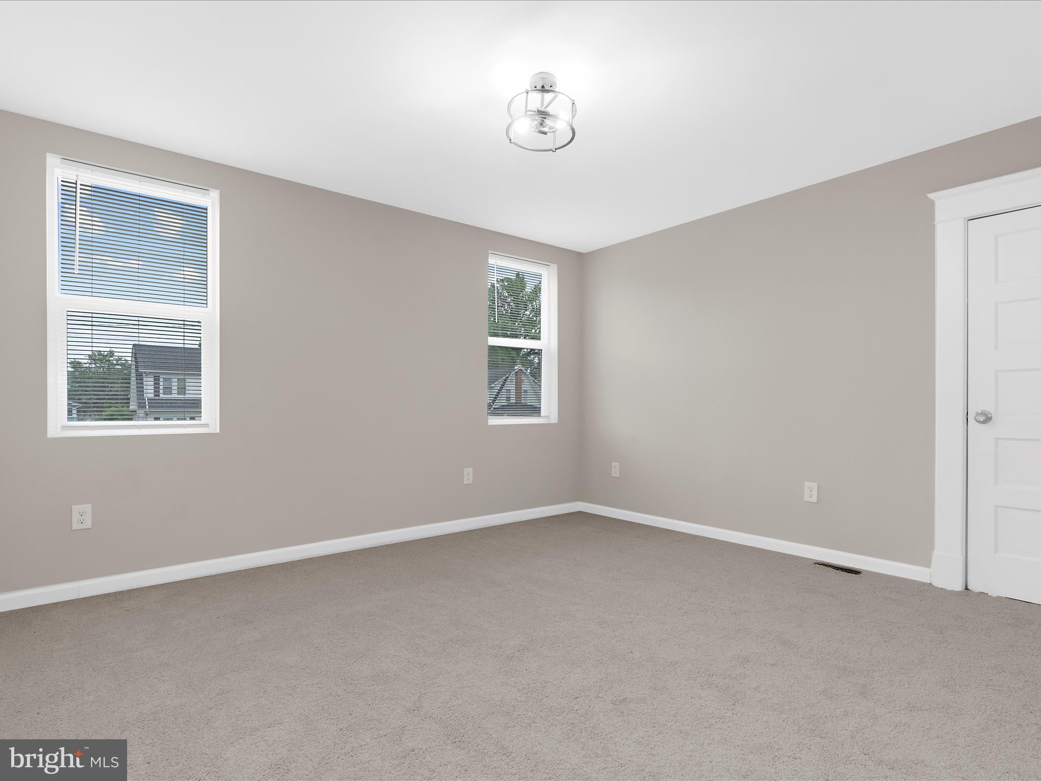 3708 Mohawk Avenue Baltimore, MD 21207 - Photo 31 of 54 a view of an empty room with a window